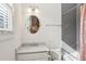 Bright bathroom featuring subway tile shower and natural light from the window at 213 Oak Ln, Decatur, GA 30030