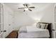 Comfortable bedroom featuring a ceiling fan, natural light, and hardwood floors at 213 Oak Ln, Decatur, GA 30030