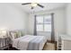 Cozy bedroom featuring hardwood floors, natural light, and a comfortable sleeping space at 213 Oak Ln, Decatur, GA 30030