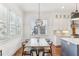 Bright dining room features a large window, wooden table, and pendant lighting at 213 Oak Ln, Decatur, GA 30030