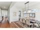 Elegant dining room with wood floors, shiplap walls, and stylish modern chandelier at 213 Oak Ln, Decatur, GA 30030