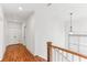 Second floor hallway with hardwood floors and natural lighting at 213 Oak Ln, Decatur, GA 30030