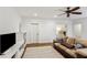 Relaxing living room with TV, built-in shelves, hardwood floors and a cozy rug at 213 Oak Ln, Decatur, GA 30030