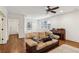 Comfortable living room with hardwood floors, natural light, and a classic piano at 213 Oak Ln, Decatur, GA 30030