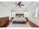 Main bedroom features a tray ceiling, wood floors, and natural light at 213 Oak Ln, Decatur, GA 30030