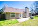 Backyard view of a home with a concrete patio and green grass at 314 Meadow Spring Dr, Temple, GA 30179