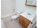 Bathroom with tub and shower and a sink with wooden cabinet at 314 Meadow Spring Dr, Temple, GA 30179