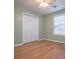 Bedroom with hardwood floors, closet and a window at 314 Meadow Spring Dr, Temple, GA 30179