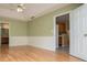 Bedroom with wood floors and view of kitchen and bathroom at 314 Meadow Spring Dr, Temple, GA 30179