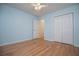 Bedroom with hardwood floors, closet and a ceiling fan at 314 Meadow Spring Dr, Temple, GA 30179