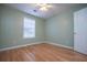 Bedroom with hardwood floors, a window and a ceiling fan at 314 Meadow Spring Dr, Temple, GA 30179