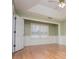 Bedroom featuring trim work, a large window, and light wood floors at 314 Meadow Spring Dr, Temple, GA 30179