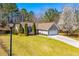 Single-Gathering home with two-car garage, mature landscaping, and inviting entrance at 314 Meadow Spring Dr, Temple, GA 30179