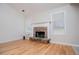 Living room with stone fireplace and hardwood floors at 314 Meadow Spring Dr, Temple, GA 30179