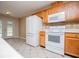 Well-equipped kitchen with white appliances and light wood cabinets at 314 Meadow Spring Dr, Temple, GA 30179