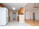 Bright kitchen with white appliances, wood cabinets, and tiled floors at 314 Meadow Spring Dr, Temple, GA 30179