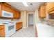 Kitchen with white countertops, tile backsplash, and wooden cabinets at 314 Meadow Spring Dr, Temple, GA 30179