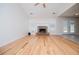 Spacious living room featuring stone fireplace and hardwood floors at 314 Meadow Spring Dr, Temple, GA 30179