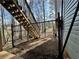 View of a fenced backyard with stairs leading up to the house at 401 Carrie Kathleen Ter, Carrollton, GA 30116