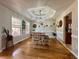 Bright and airy dining room with chandelier and views of the surrounding landscape, perfect for entertaining at 401 Carrie Kathleen Ter, Carrollton, GA 30116