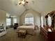 Spacious main bedroom features high vaulted ceilings, ceiling fan, and large windows for natural light at 401 Carrie Kathleen Ter, Carrollton, GA 30116