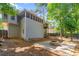 Backyard of home with exterior view of screened-in porch and patio area with fire pit at 4956 Braeburn Nw Trce, Acworth, GA 30102