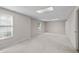 Basement area with carpeted floors, windows for light, and neutral walls at 4956 Braeburn Nw Trce, Acworth, GA 30102