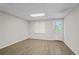 Finished basement includes a vinyl floor, window, and access to the outside at 4956 Braeburn Nw Trce, Acworth, GA 30102