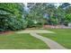 A basketball court on a large lawn next to the community pool area at 4956 Braeburn Nw Trce, Acworth, GA 30102