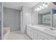 Bathroom featuring double sinks, a tub, and shower at 4956 Braeburn Nw Trce, Acworth, GA 30102