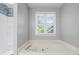 Bright bathroom featuring a large tub at 4956 Braeburn Nw Trce, Acworth, GA 30102