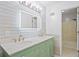 Bathroom featuring a double sink vanity, and a shower/tub at 4956 Braeburn Nw Trce, Acworth, GA 30102
