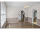 Dining room with natural light and arched entryways to stairs and other rooms at 4956 Braeburn Nw Trce, Acworth, GA 30102