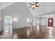 Spacious living room with hardwood floors, a ceiling fan, and ample natural light at 4956 Braeburn Nw Trce, Acworth, GA 30102