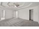 Spacious main bedroom featuring a walk-in closet and carpeted floors at 4956 Braeburn Nw Trce, Acworth, GA 30102