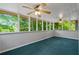 Enclosed porch with windows and view of trees at 4956 Braeburn Nw Trce, Acworth, GA 30102