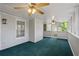 Screened porch with carpet, windows, and ceiling fans at 4956 Braeburn Nw Trce, Acworth, GA 30102