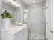 Elegant bathroom with white marble shower, white vanity, and modern fixtures at 6616 Aria Village Dr, Atlanta, GA 30328