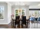 Cozy dining room with modern lighting and hardwood floors at 6616 Aria Village Dr, Atlanta, GA 30328