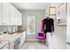 Chic laundry room with custom cabinets, modern appliances, and stylish decor at 6616 Aria Village Dr, Atlanta, GA 30328