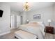 Bright main bedroom with neutral walls, carpet, and contemporary lighting at 6616 Aria Village Dr, Atlanta, GA 30328