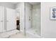 Modern glass enclosed shower with marble tile and brushed fixtures at 6616 Aria Village Dr, Atlanta, GA 30328