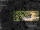 An aerial view of the property shows the house with driveway surrounded by trees and additional buildings on the lot at 741 Se Knox Se Dr, Atlanta, GA 30315