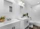 Bathroom with double vanities, tile backsplash, and a shower-tub combination at 741 Se Knox Se Dr, Atlanta, GA 30315