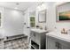 Bright bathroom with subway tile shower and double vanity with granite countertops at 741 Se Knox Se Dr, Atlanta, GA 30315