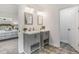 Bathroom featuring dual vanity sinks and view into connected bedroom space at 741 Se Knox Se Dr, Atlanta, GA 30315