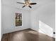 Bright and airy bedroom featuring hardwood floors, white walls, and a ceiling fan for a clean and comfortable space at 741 Se Knox Se Dr, Atlanta, GA 30315