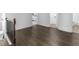 A stylish hallway with dark hardwood floors and view to the bedroom and bathroom at 741 Se Knox Se Dr, Atlanta, GA 30315