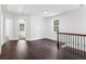 View of hardwood flooring and ornate staircase leading to the upper level at 741 Se Knox Se Dr, Atlanta, GA 30315