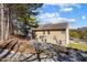 Backyard with house featuring a basketball hoop and a stone retaining wall at 949 Tumlin Trce, Lawrenceville, GA 30045